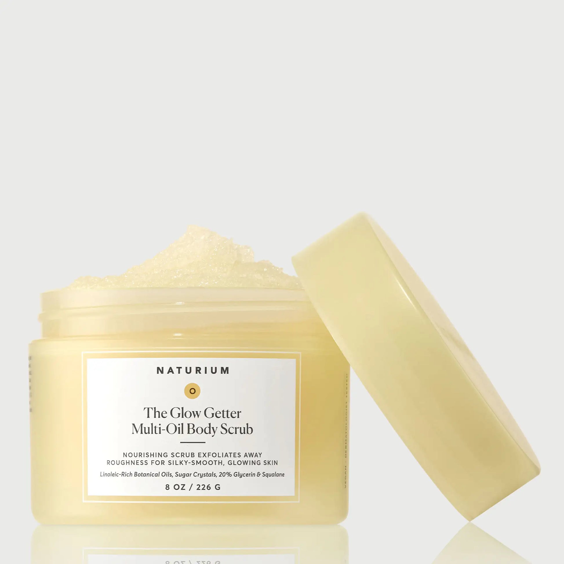 the-glow-getter-multi-oil-body-scrub-m7 NATR-40028-GlowGetter-Multi-Oil-Body-Scrub-Front-CapOff-bonebkgd.webp